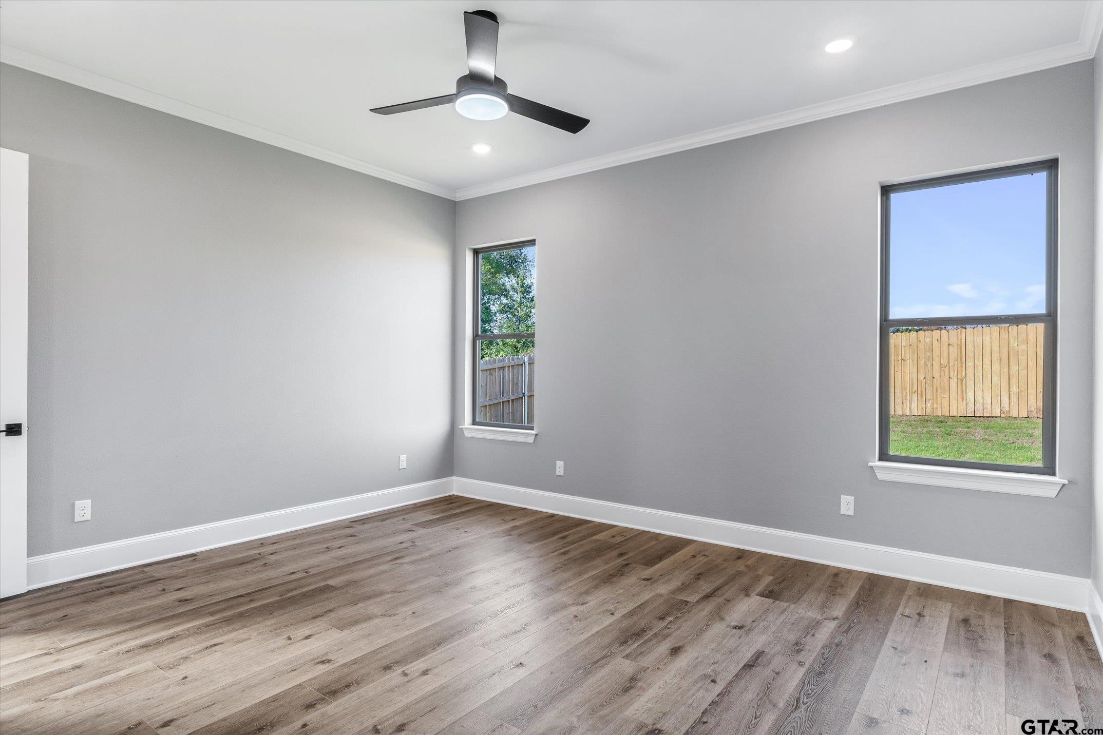 403 Sides Bullard, TX 75757 - Photo 18 of 33 a view of an empty room with wooden floor and a window
