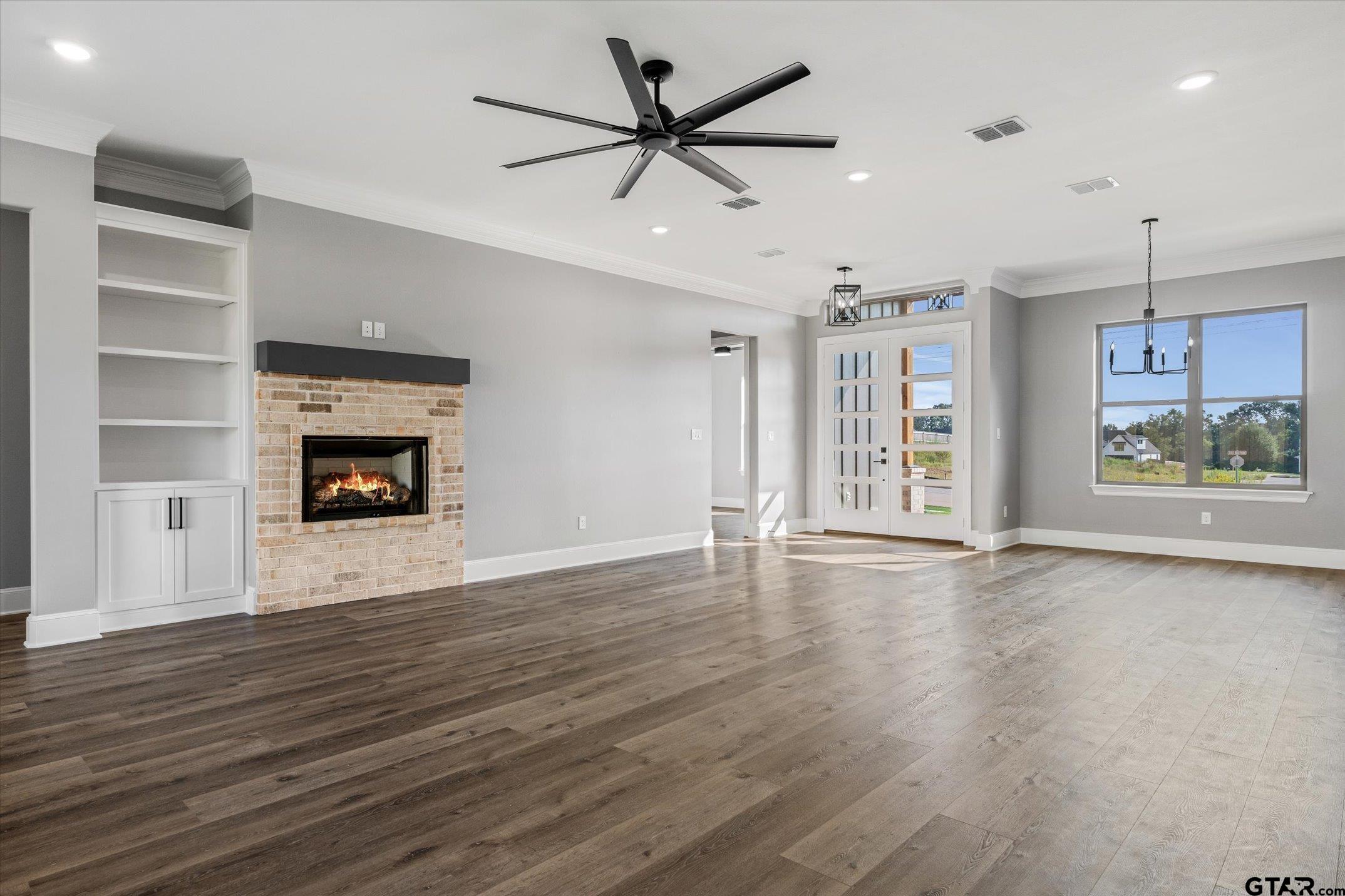 403 Sides Bullard, TX 75757 - Photo 20 of 33 a view of an empty room with a window and fireplace
