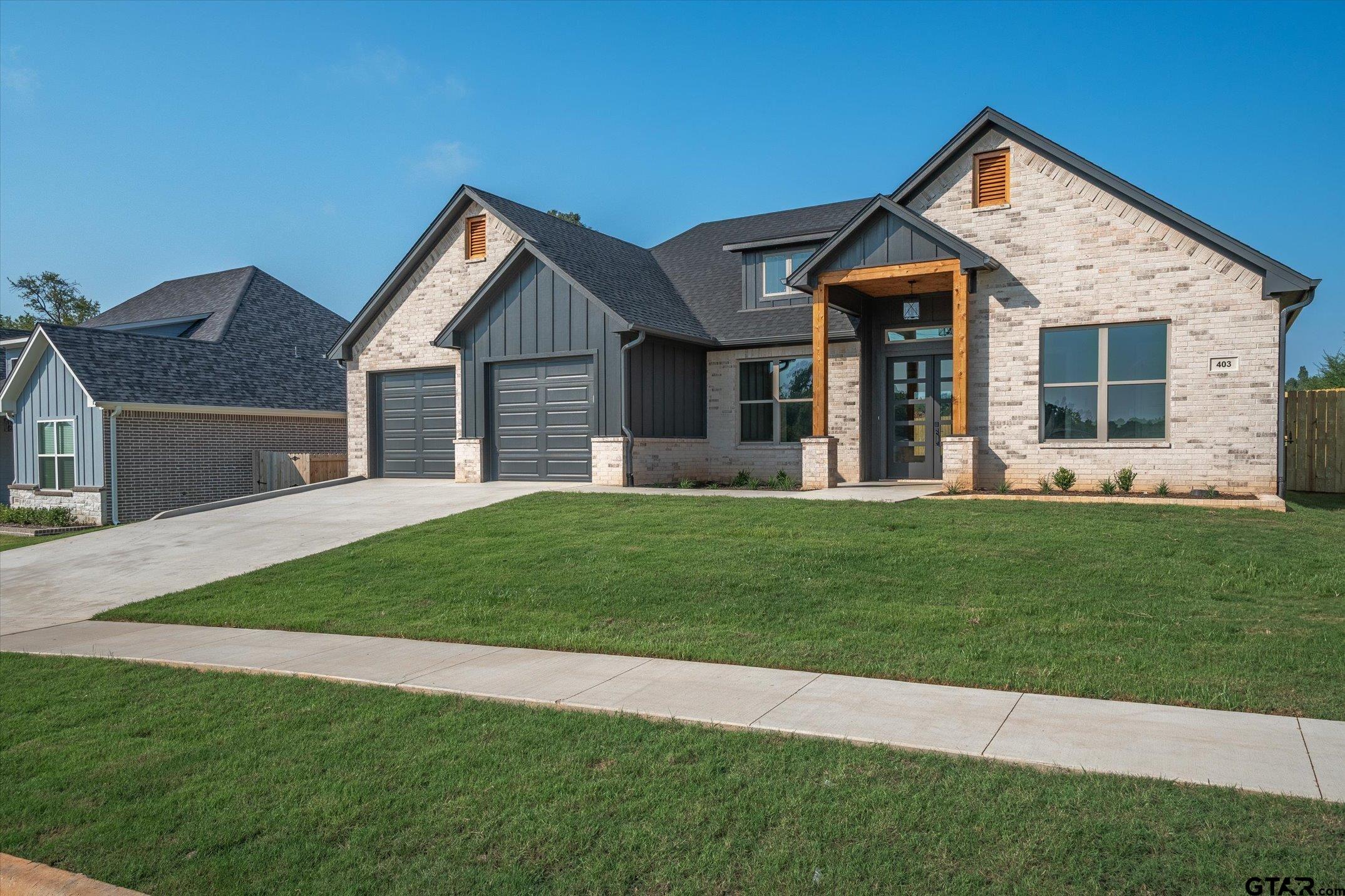 403 Sides Bullard, TX 75757 - Photo 2 of 33 a front view of a house with a yard and porch