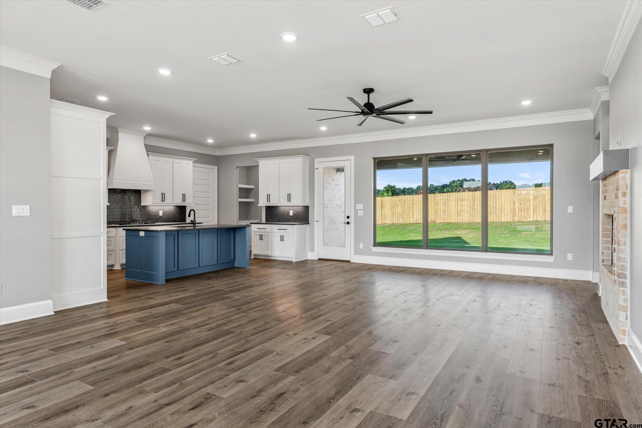 403 Sides Bullard, TX 75757 - Photo 24 of 33 a view of an empty room with wooden floor and a window