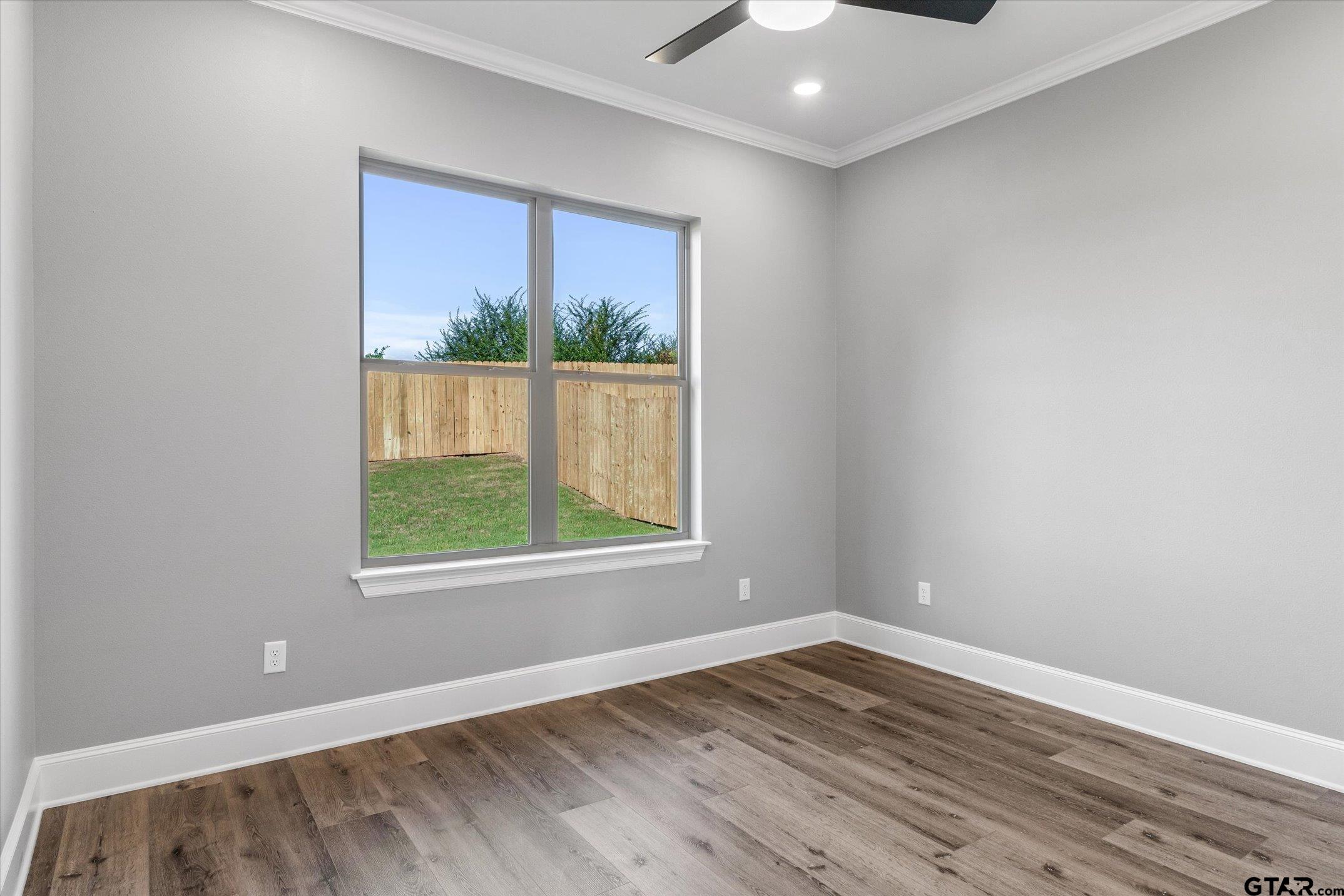 403 Sides Bullard, TX 75757 - Photo 29 of 33 an empty room with wooden floor and windows