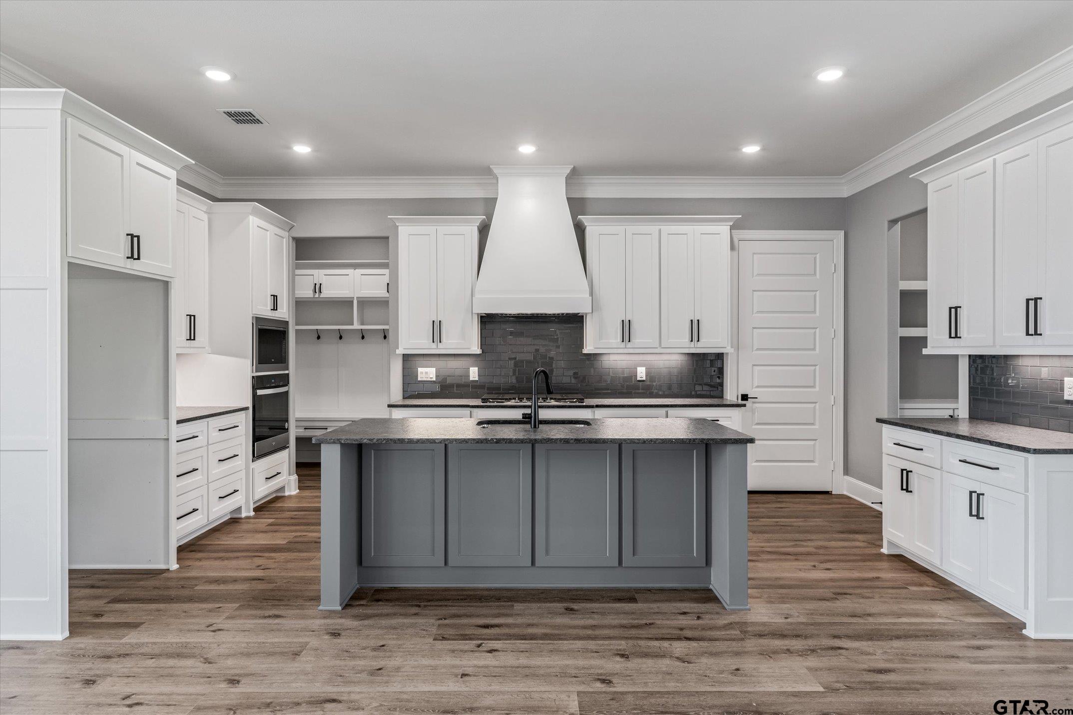 403 Sides Bullard, TX 75757 - Photo 5 of 33 a kitchen with stainless steel appliances granite countertop a sink stove and refrigerator