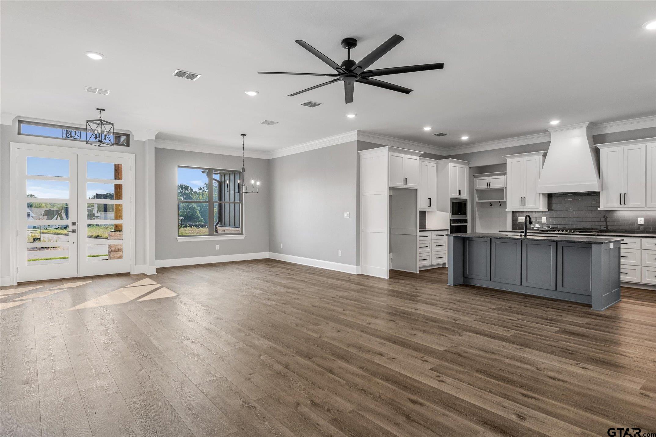 403 Sides Bullard, TX 75757 - Photo 6 of 33 a view of kitchen with refrigerator stove and wooden floor