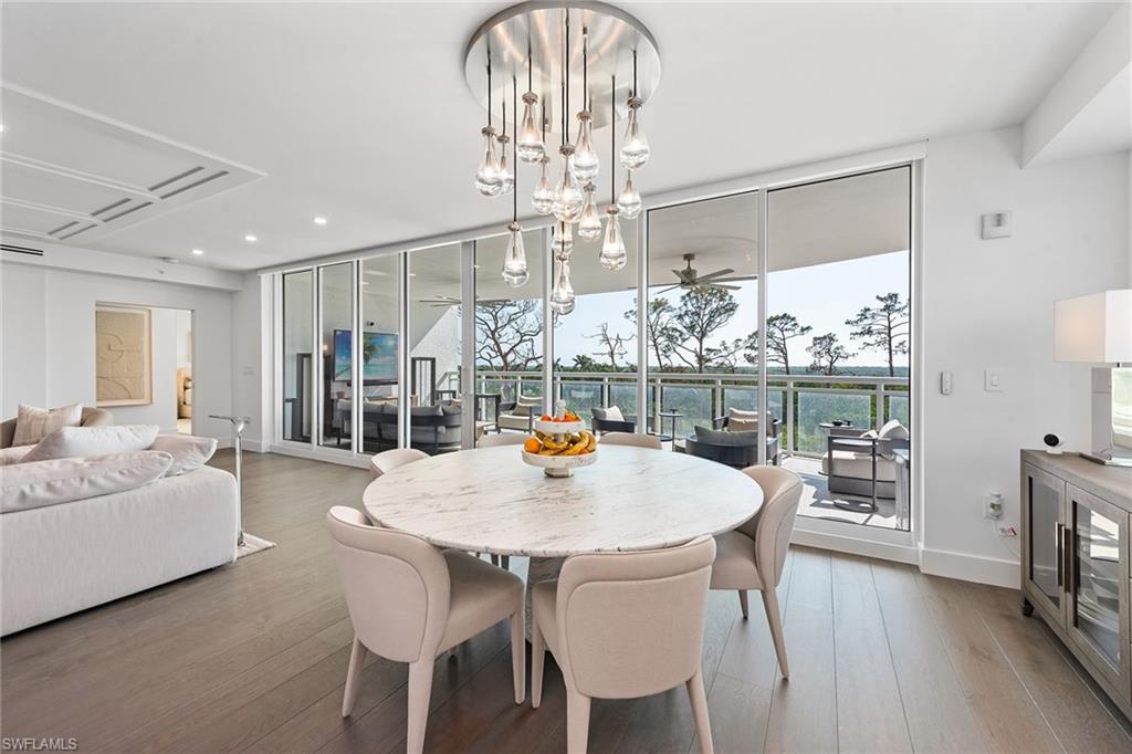 13945 Old Coast Road, Unit 406 Naples, FL 34110 - Photo 11 of 46 a view of a dining room with furniture window and outside view