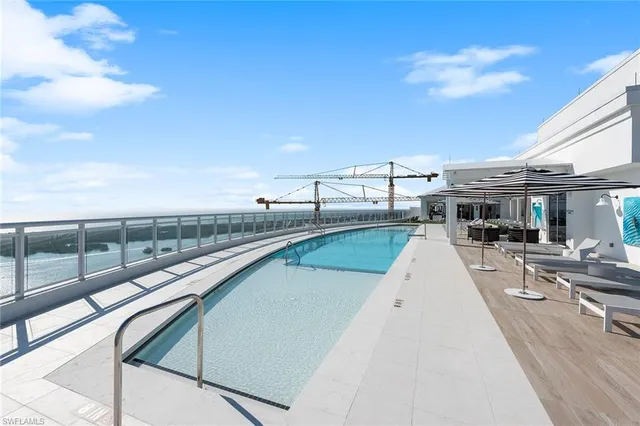 a view of a swimming pool with a patio