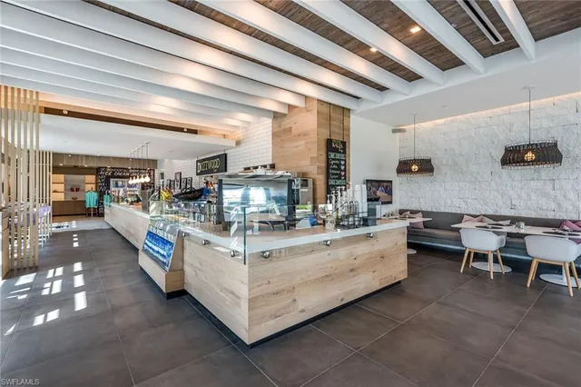 a kitchen with stainless steel appliances kitchen island granite countertop lots of counter top space