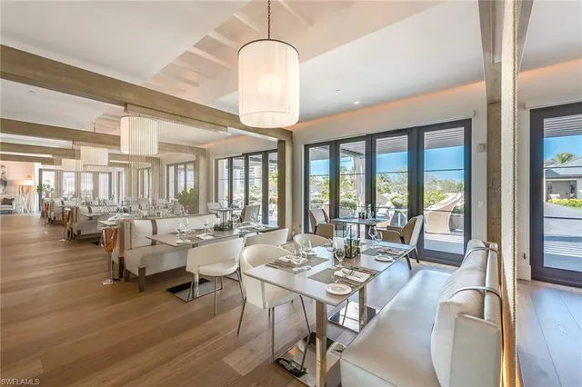 a view of a dining room with furniture window and wooden floor