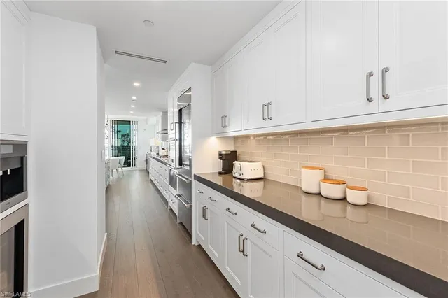 a hallway with view of living room