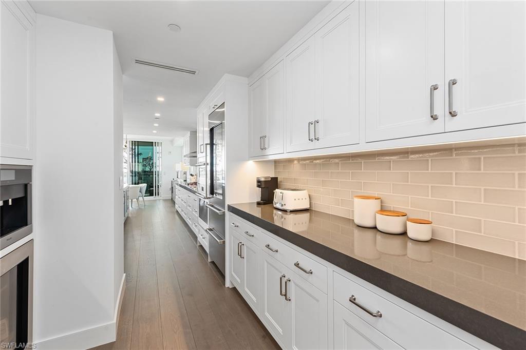 13945 Old Coast Road, Unit 406 Naples, FL 34110 - Photo 10 of 46 a hallway with view of living room