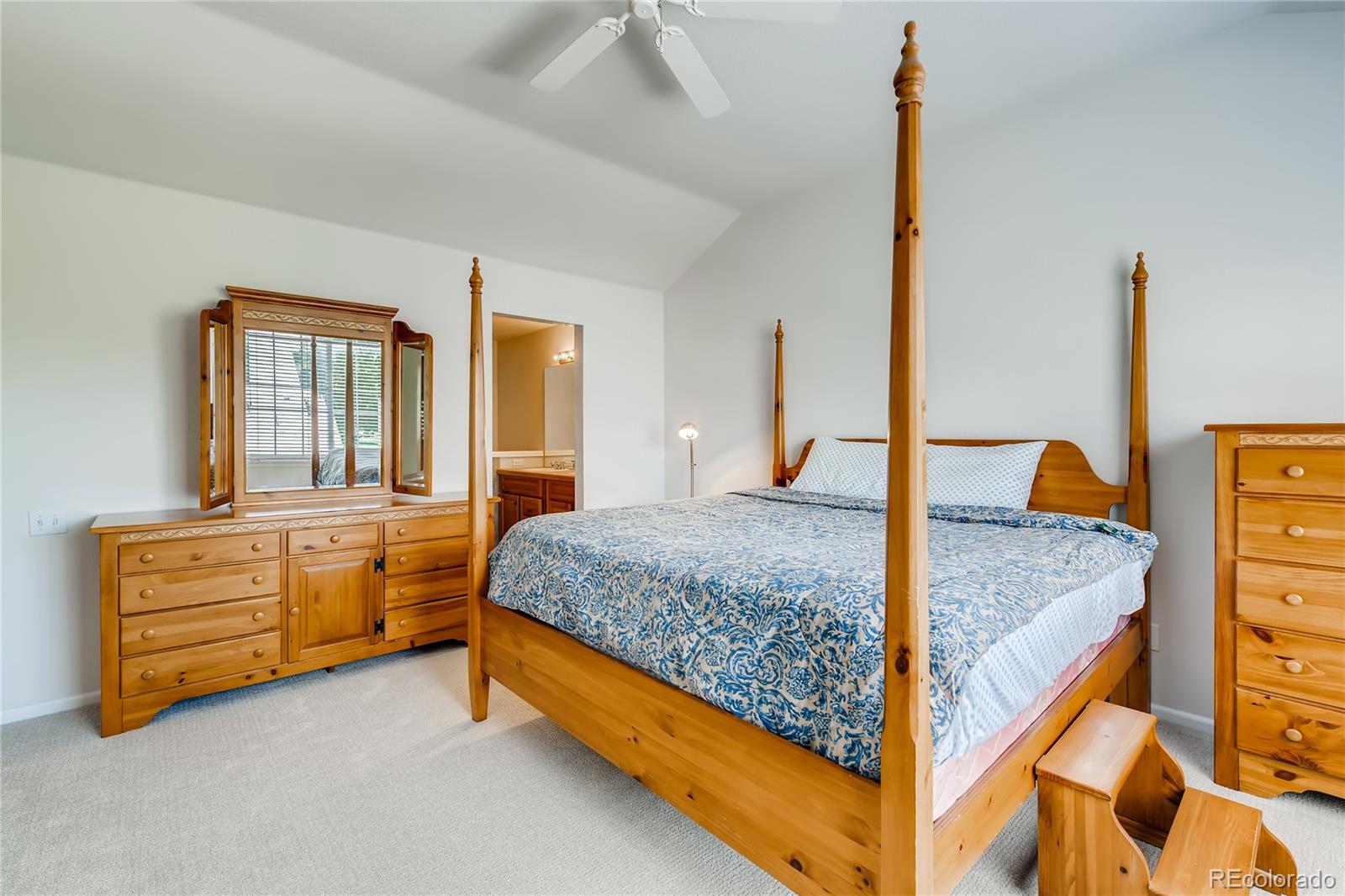6137 Trailhead Road Highlands Ranch, CO 80130 - Photo 11 of 27 a bedroom with a bed and wooden floor
