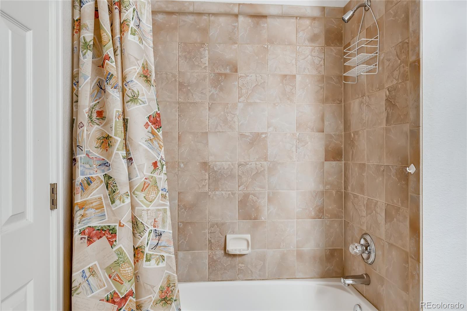 6137 Trailhead Road Highlands Ranch, CO 80130 - Photo 17 of 27 a bathroom with a shower curtain