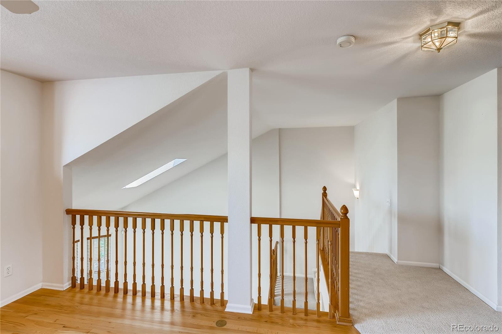 6137 Trailhead Road Highlands Ranch, CO 80130 - Photo 19 of 27 a view of staircase with rug