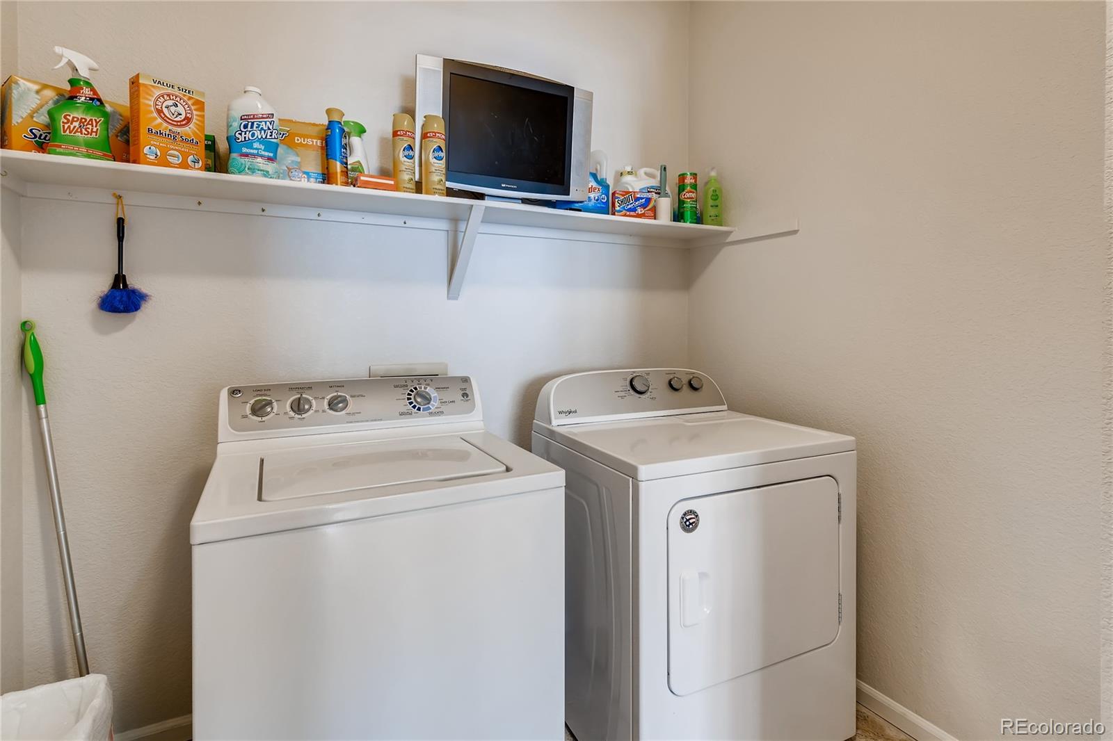 6137 Trailhead Road Highlands Ranch, CO 80130 - Photo 23 of 27 a utility room with dryer and washer