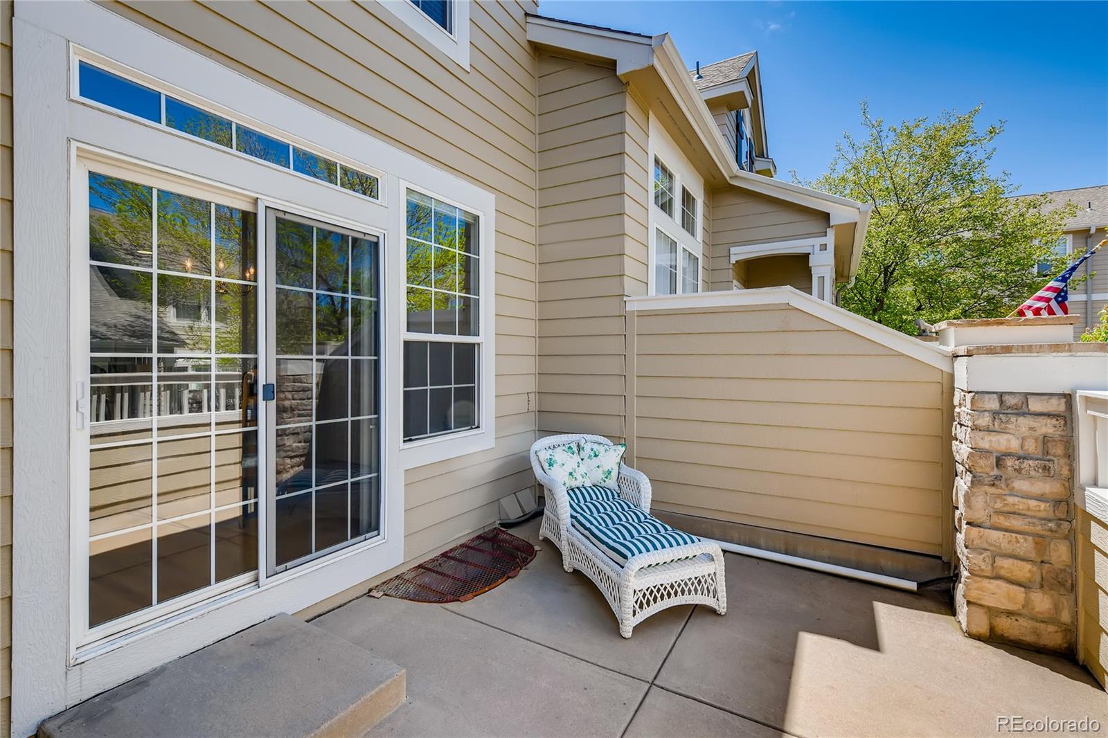 6137 Trailhead Road Highlands Ranch, CO 80130 - Photo 25 of 27 a view of a chair and table in the back yard of the house