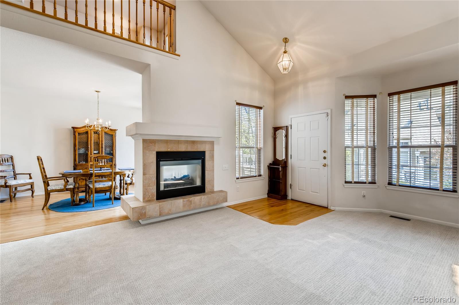 6137 Trailhead Road Highlands Ranch, CO 80130 - Photo 3 of 27 a view of a livingroom with a fireplace and window