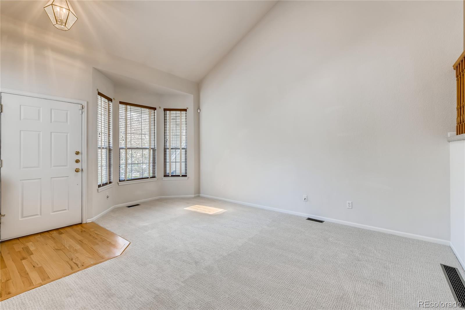 6137 Trailhead Road Highlands Ranch, CO 80130 - Photo 4 of 27 an empty room with windows