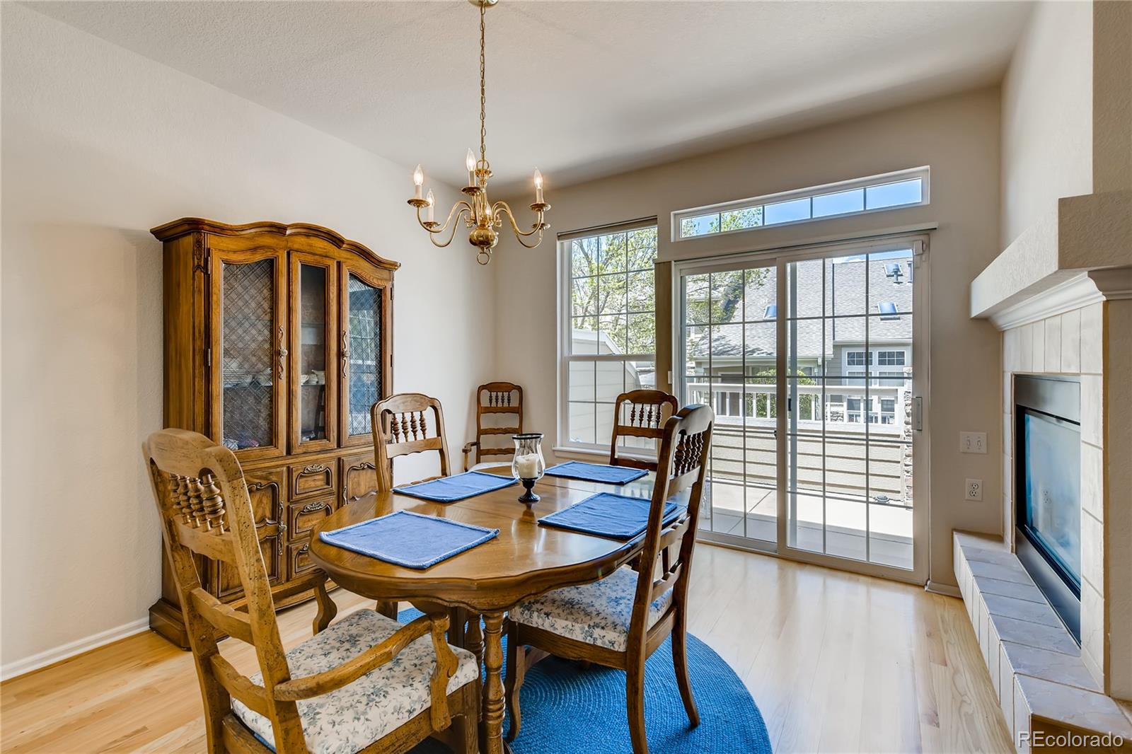 6137 Trailhead Road Highlands Ranch, CO 80130 - Photo 5 of 27 a view of a dining room with furniture window and wooden floor