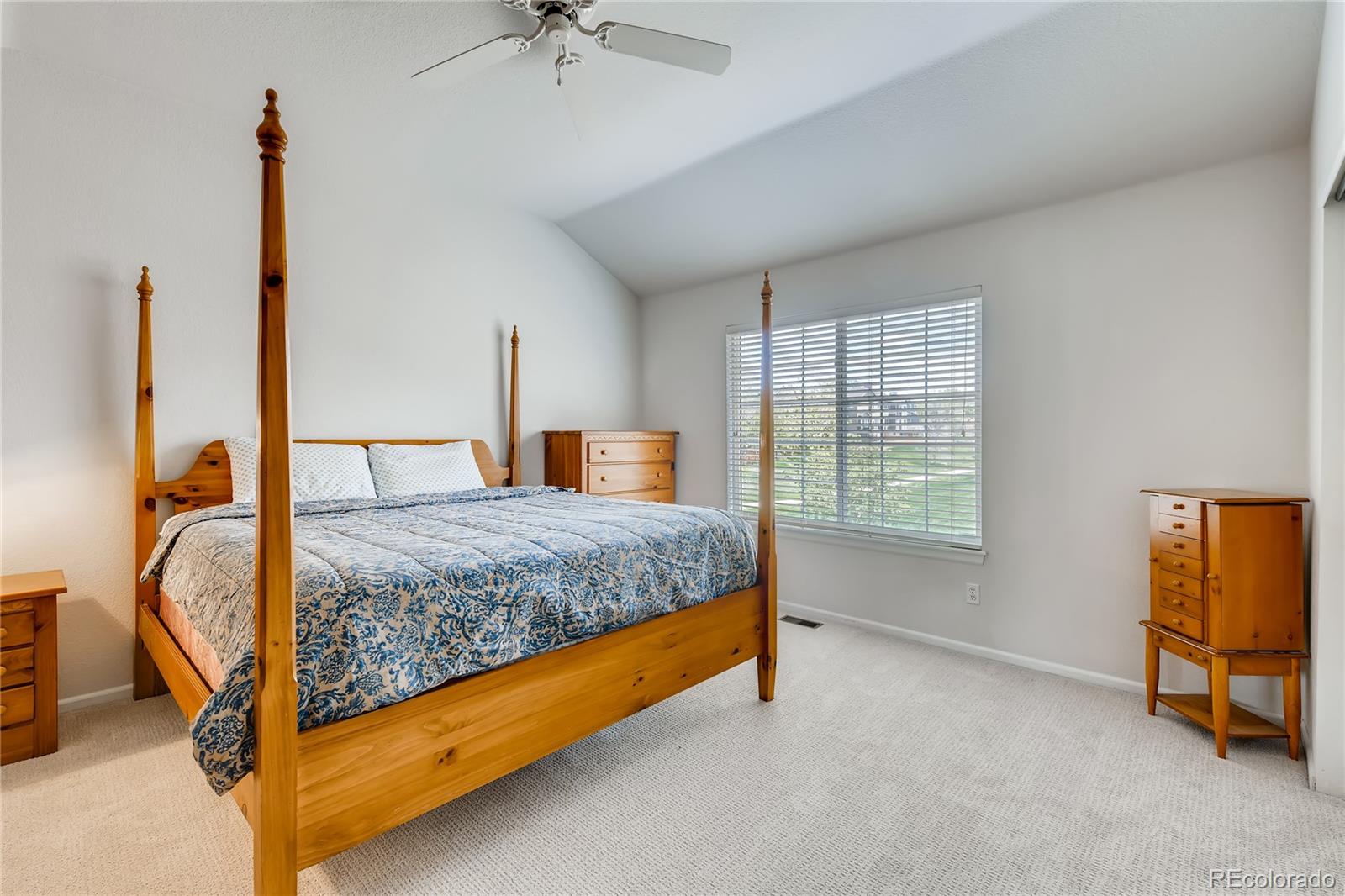 6137 Trailhead Road Highlands Ranch, CO 80130 - Photo 10 of 27 a bedroom with a bed dresser and a window