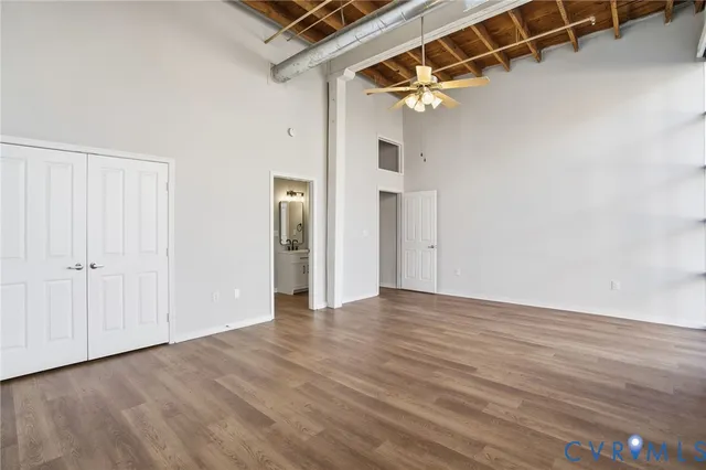 a view of a room with wooden floor