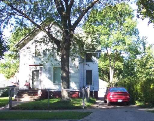 508 North Spring Street Elgin, IL 60120 - Photo 1 of 1 a front view of a house with a garden and tree