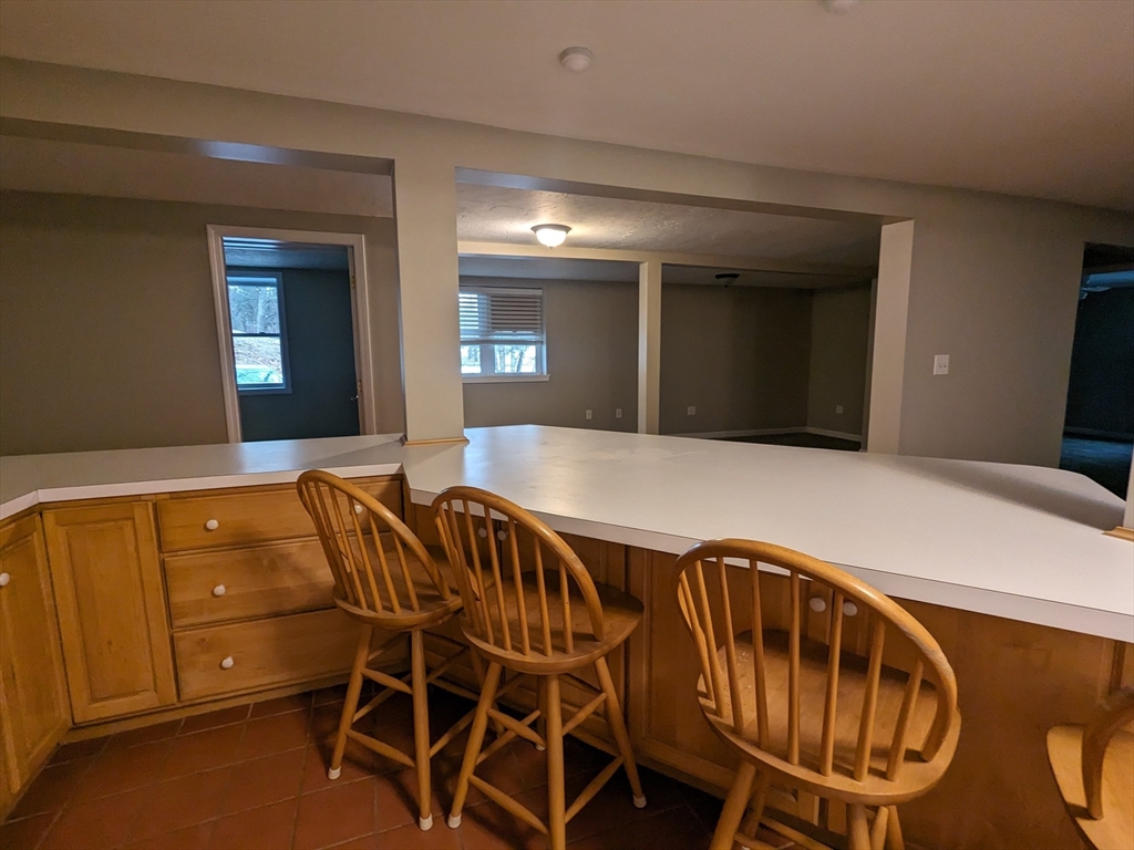 16 Hartness Road, Unit A Sutton, MA 01590 - Photo 4 of 18 a balcony with table and chairs