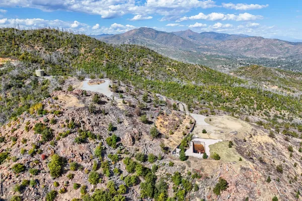 a view of a city with green field