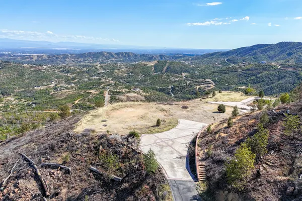 a view of a town with mountains