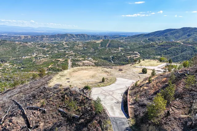 a view of a town with mountains