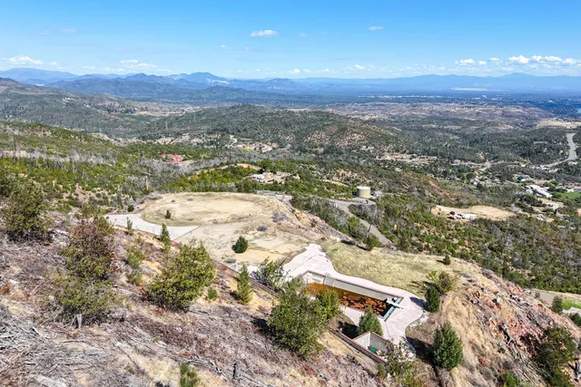 a view of a city with mountains in the background