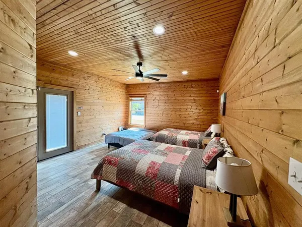 a bedroom with bed and balcony