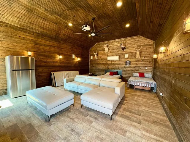 a balcony with couch and chandelier