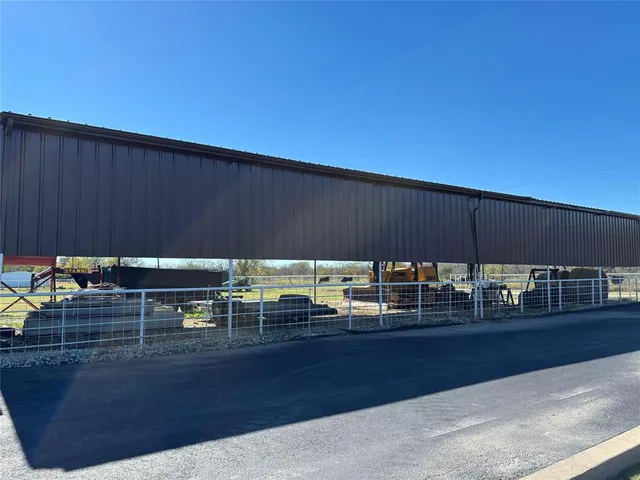a view of a patio with table and chairs