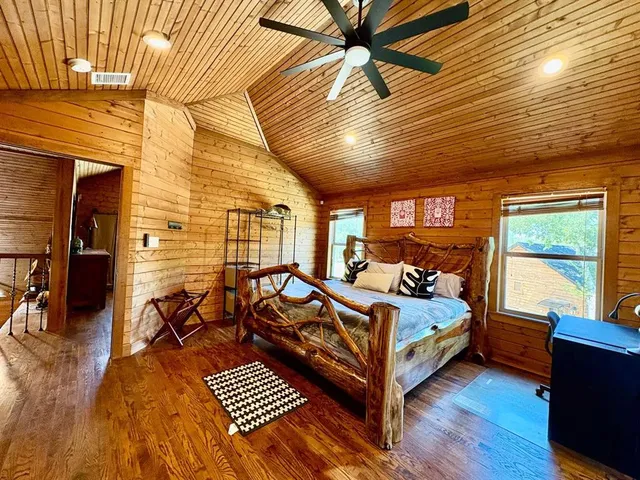 a bed room with a bed and a window