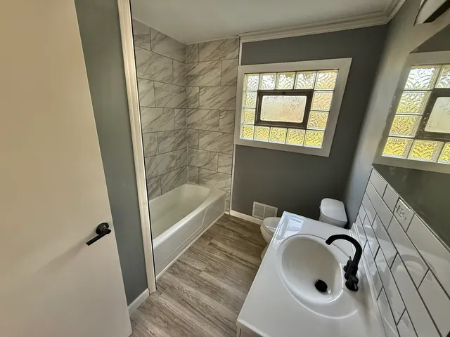 a bathroom with a sink and a bathtub