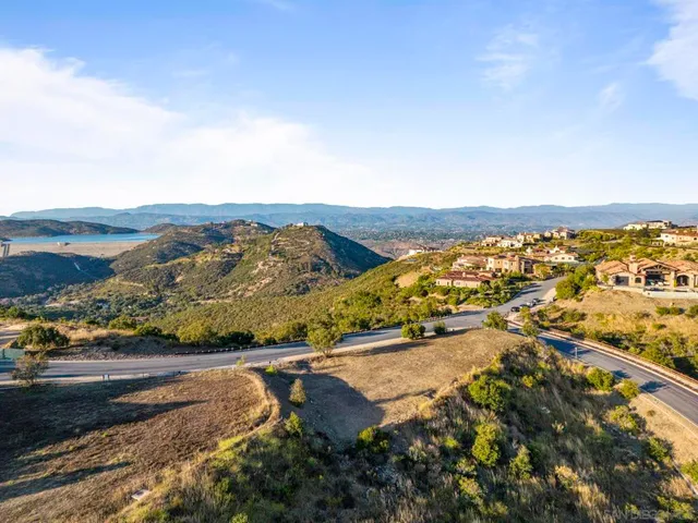 an aerial view of residential building and ocean view