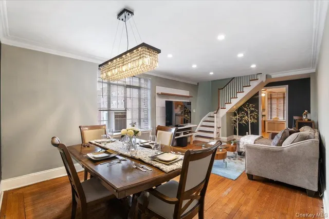 a living room with furniture a rug and a flat screen tv