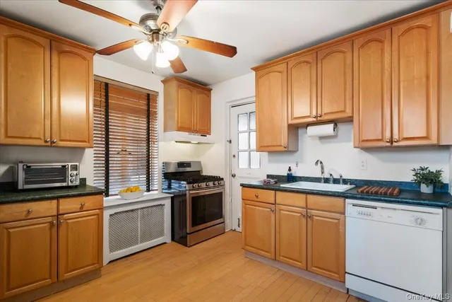 a view of a dining room with furniture wooden floor and chandelier