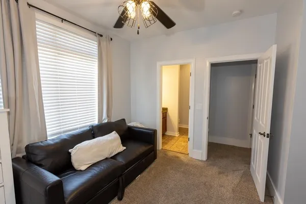 a living room with furniture and a window