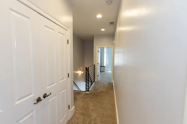 a view of a hallway with staircase