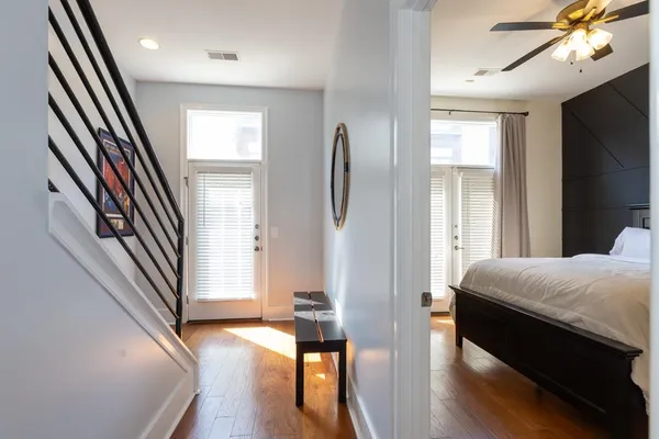 a bedroom with furniture and a window