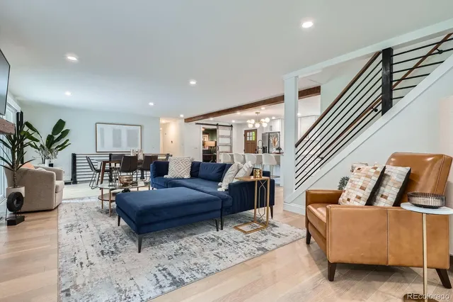a living room with furniture potted plant and a window