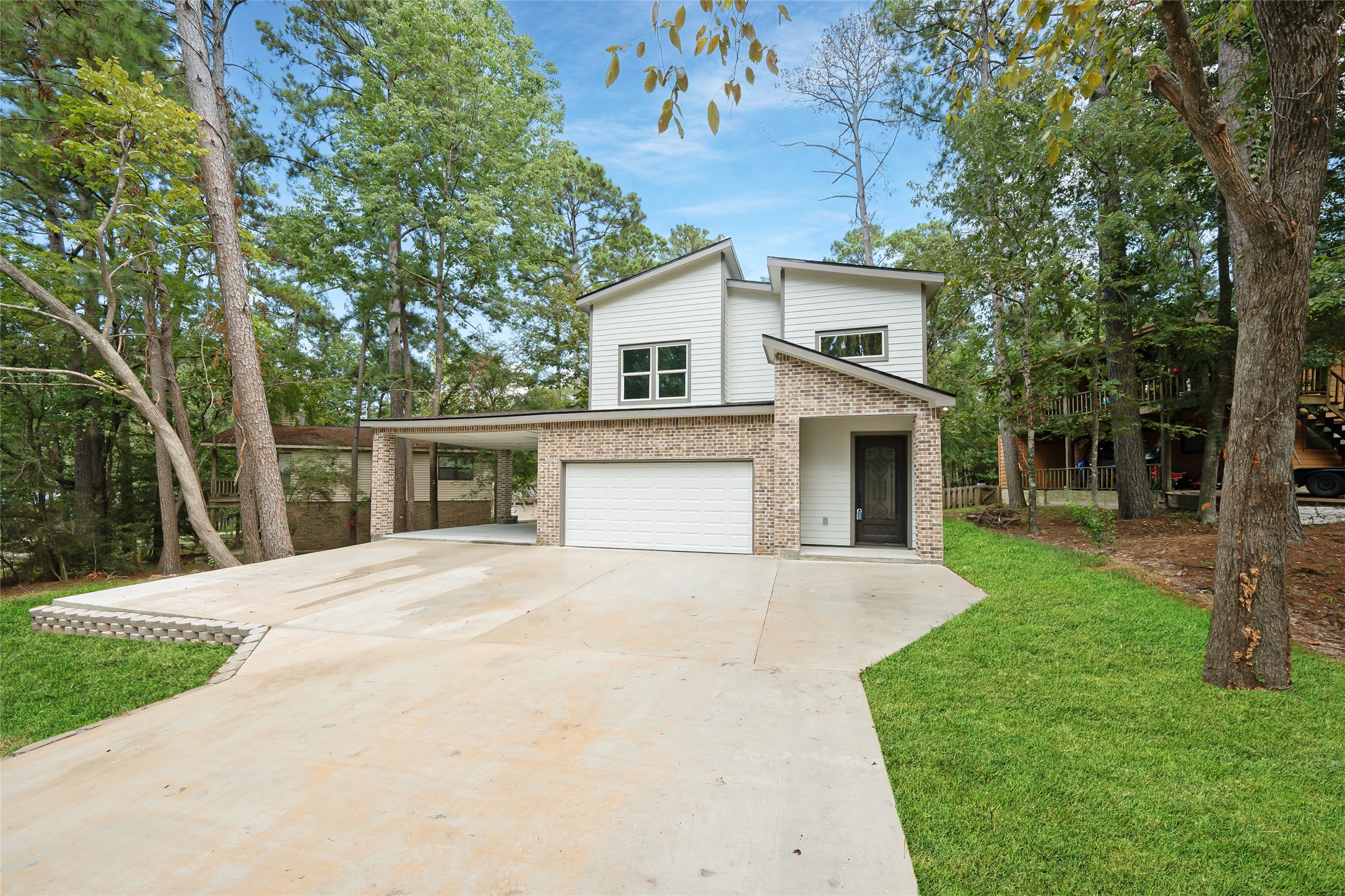 220 North Fairway Loop Coldspring, TX 77331 - Photo 1 of 30 a front view of house with yard and trees