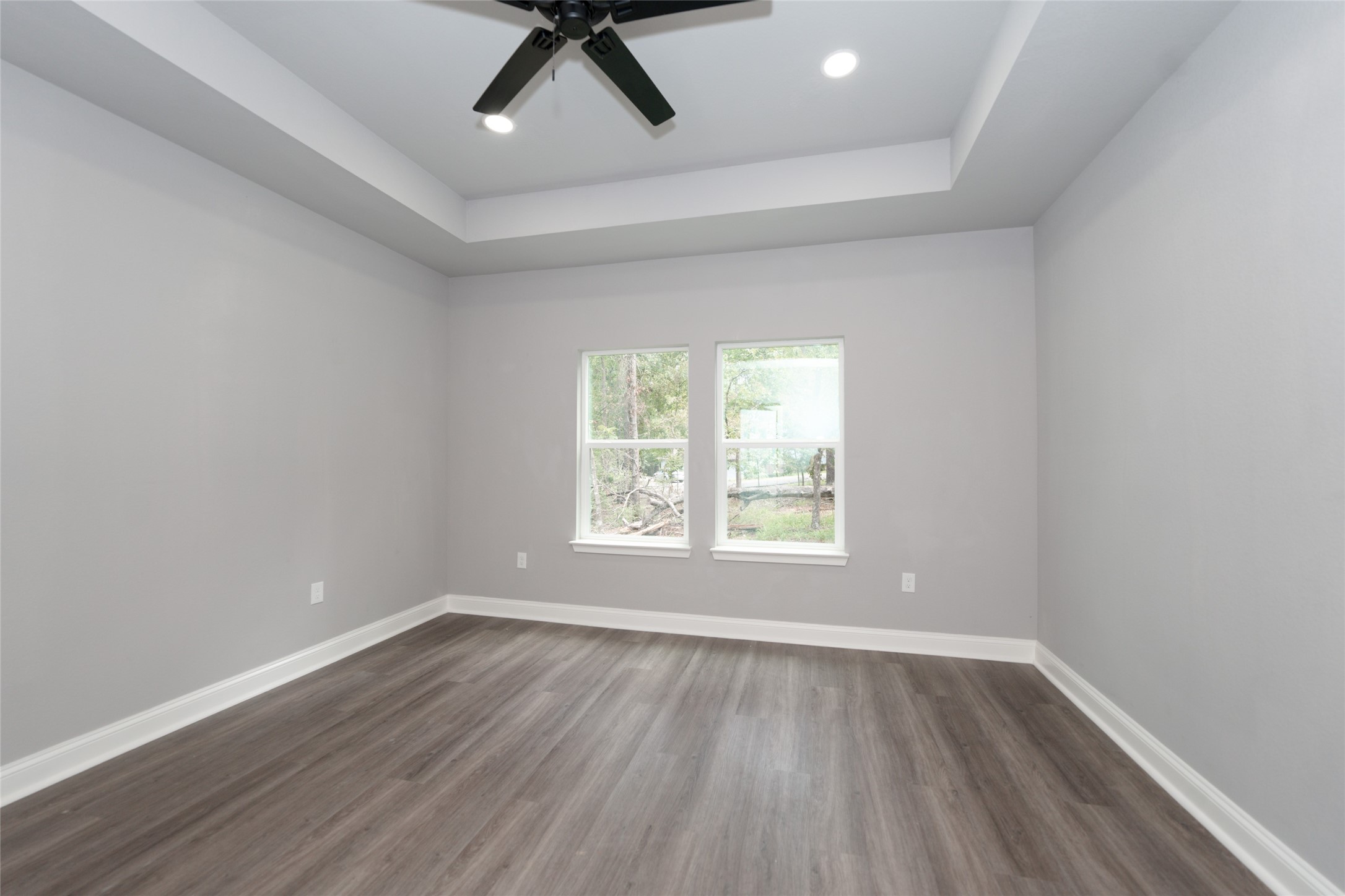 220 North Fairway Loop Coldspring, TX 77331 - Photo 11 of 30 an empty room with a window and wooden floor