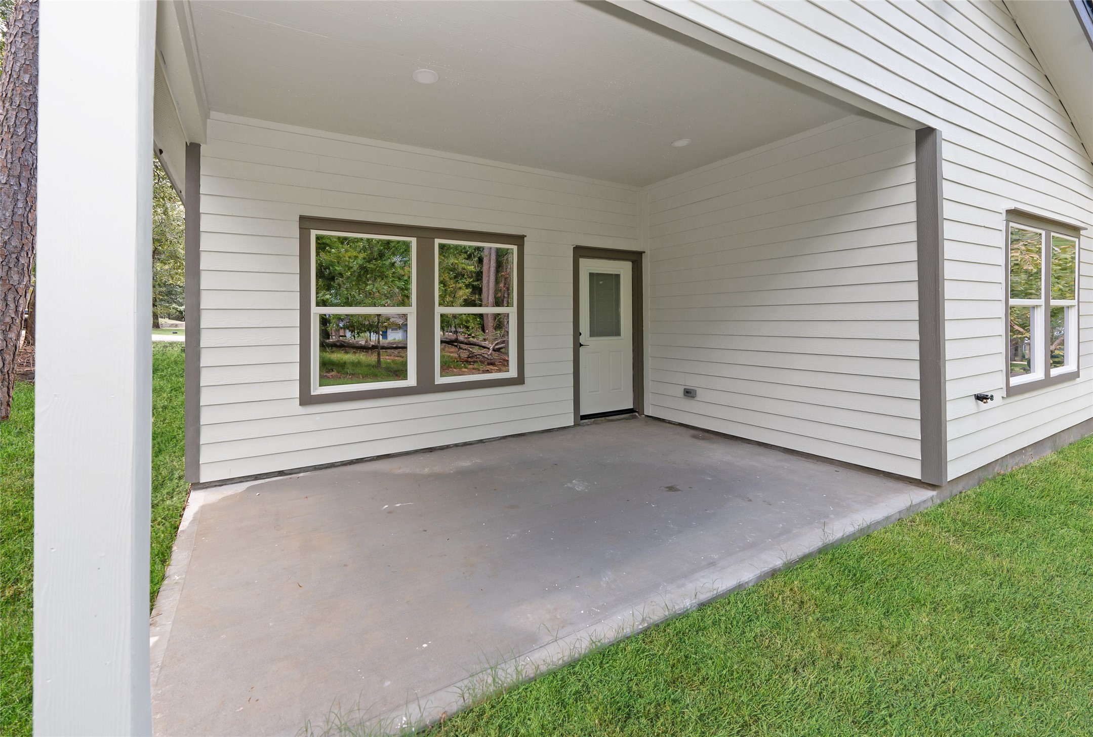 220 North Fairway Loop Coldspring, TX 77331 - Photo 29 of 30 a view of an house with backyard and porch