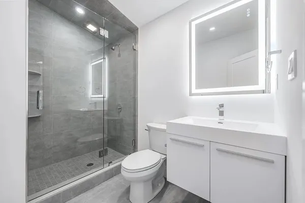 a view of kitchen with granite countertop stainless steel appliances and sink