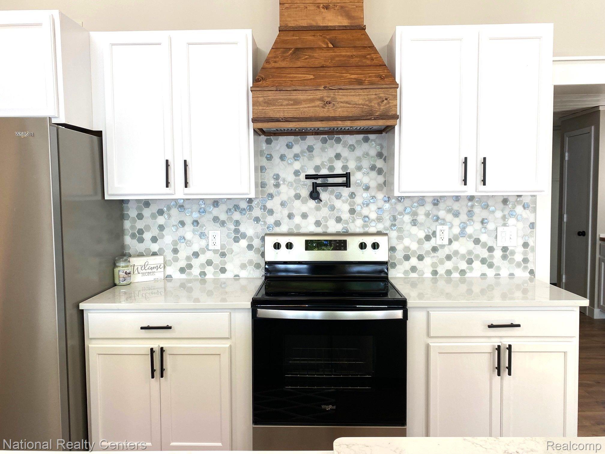 4823 Kokosing Road Hale, MI 48739 - Photo 27 of 54 ceramic back splash, pot filler, stainless stove