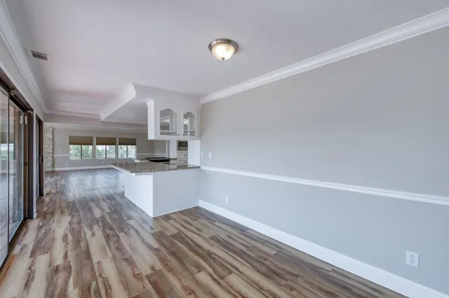 a kitchen with a refrigerator and microwave