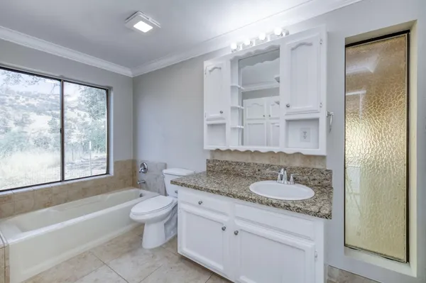 a view of a kitchen with a sink cabinets and a fireplace