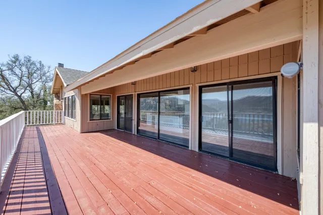 a balcony with wooden floor