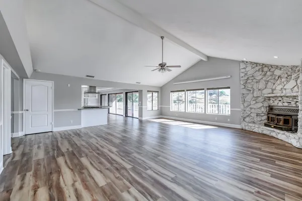 a kitchen with stainless steel appliances granite countertop a stove and a refrigerator